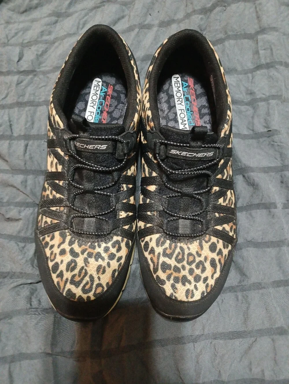 Skechers Leopard-Print Slip-On Sneakers in Black and Tan